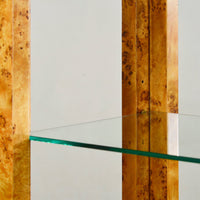 Close-up of glass shelf on burl étagère bookshelf.