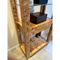 Side view of burl étagère bookshelf with drawer.
