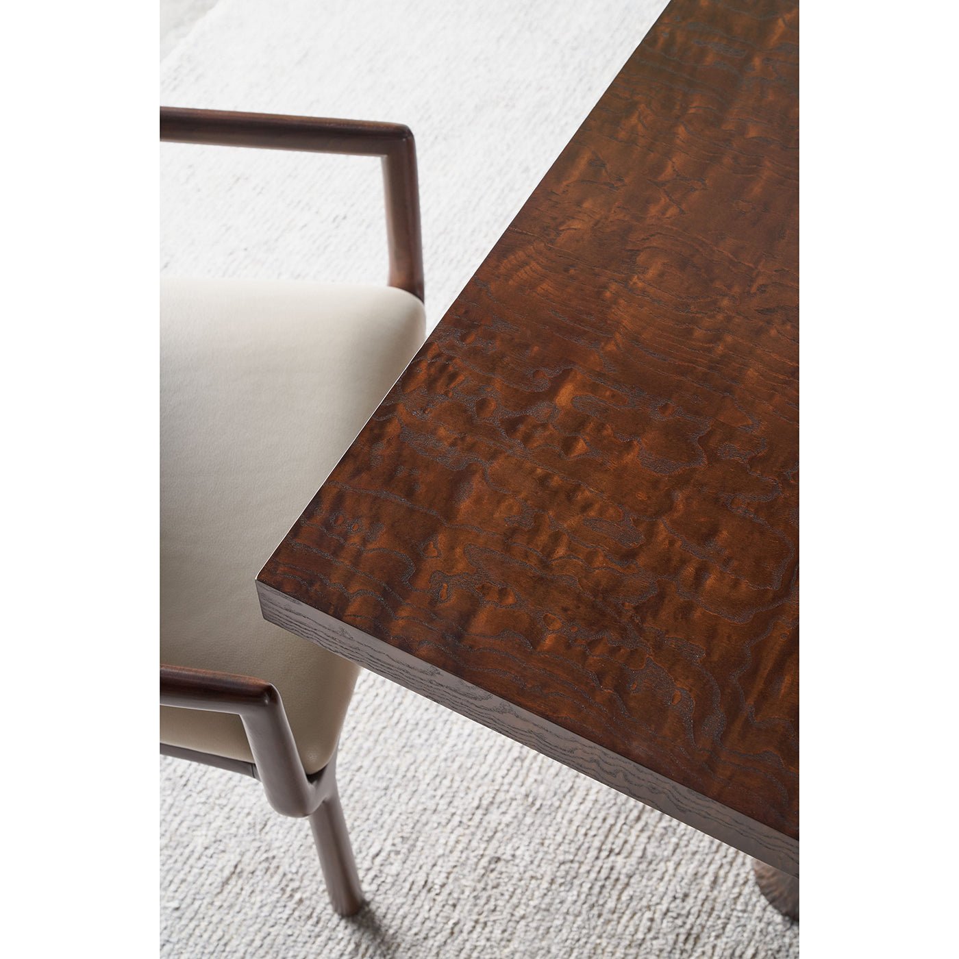 Close-up of dining table corner and chair.
