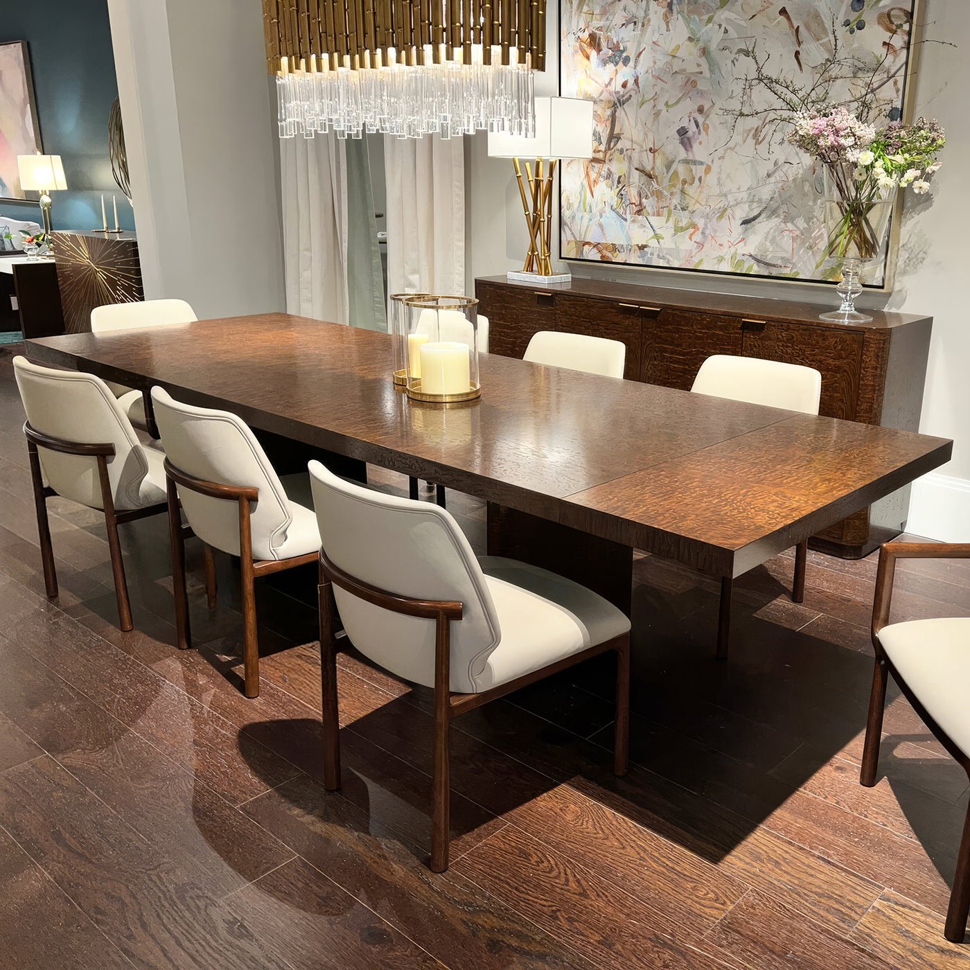 Dining table set with chairs in showroom.