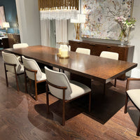 Dining table set with chairs in showroom.