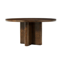 Round dining table with unique mid-century design.
