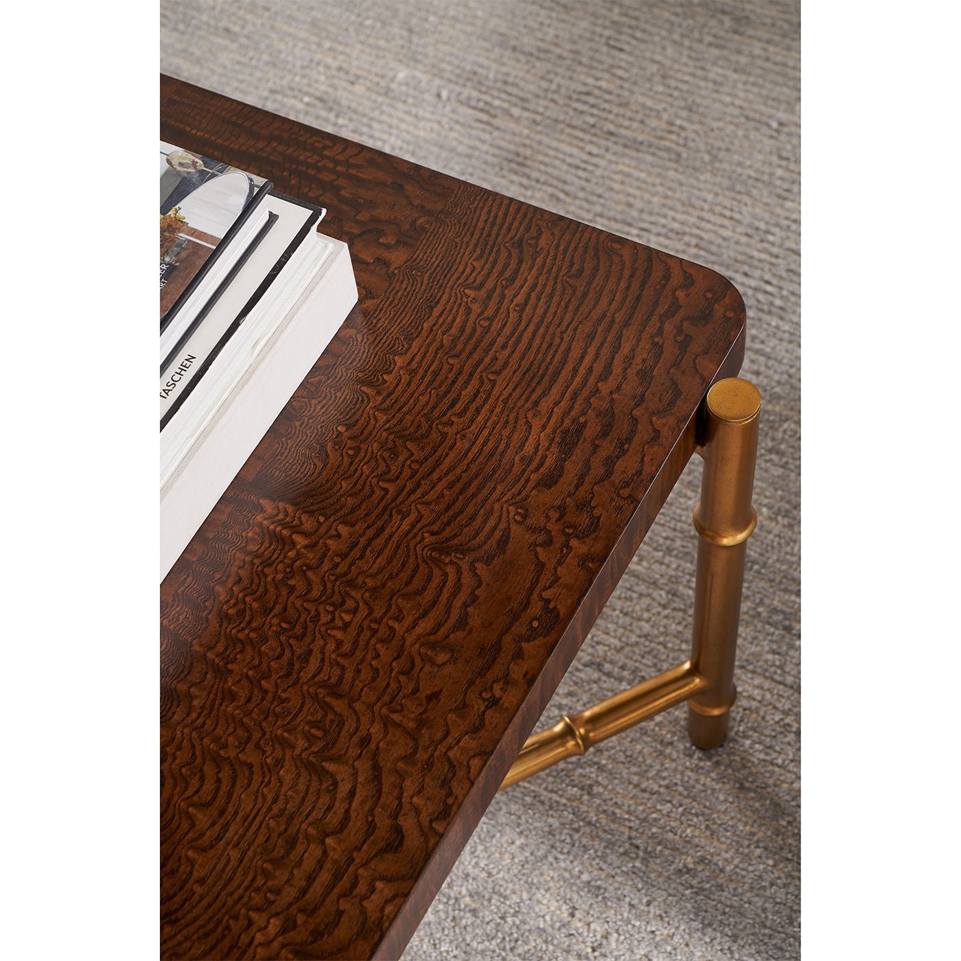 Close-up of coffee table's burl wood texture and decor.