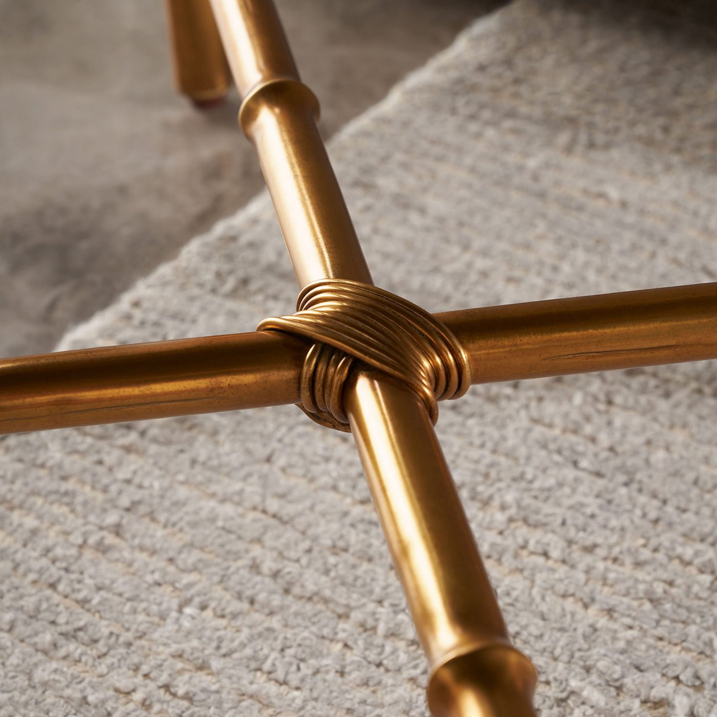 Detail of gold base crossbar on end table.