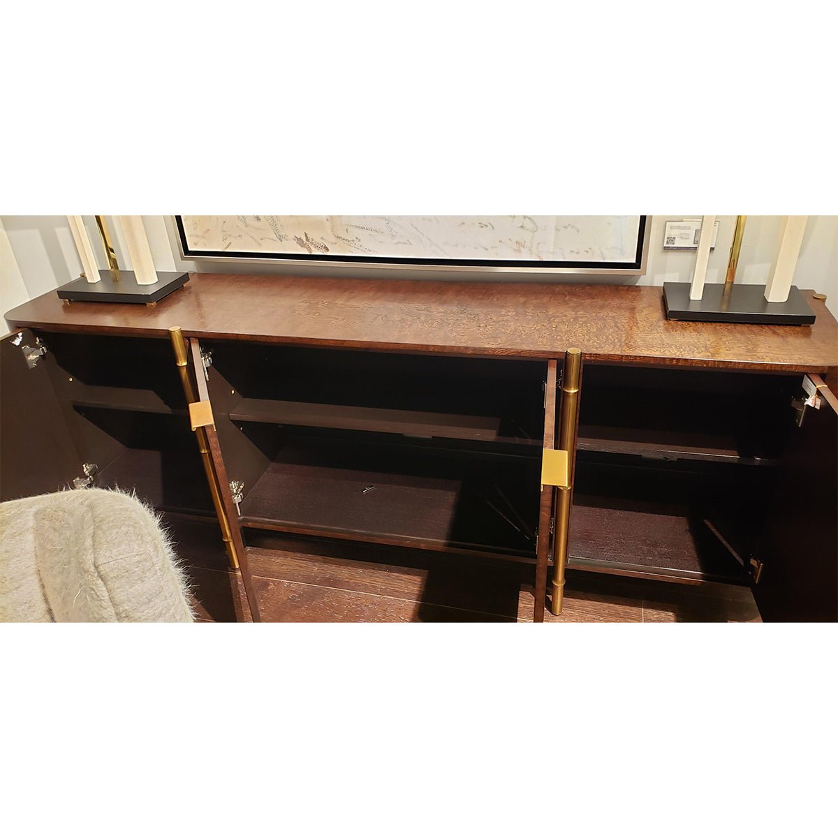 Interior shelving of mid-century burl wood sideboard.
