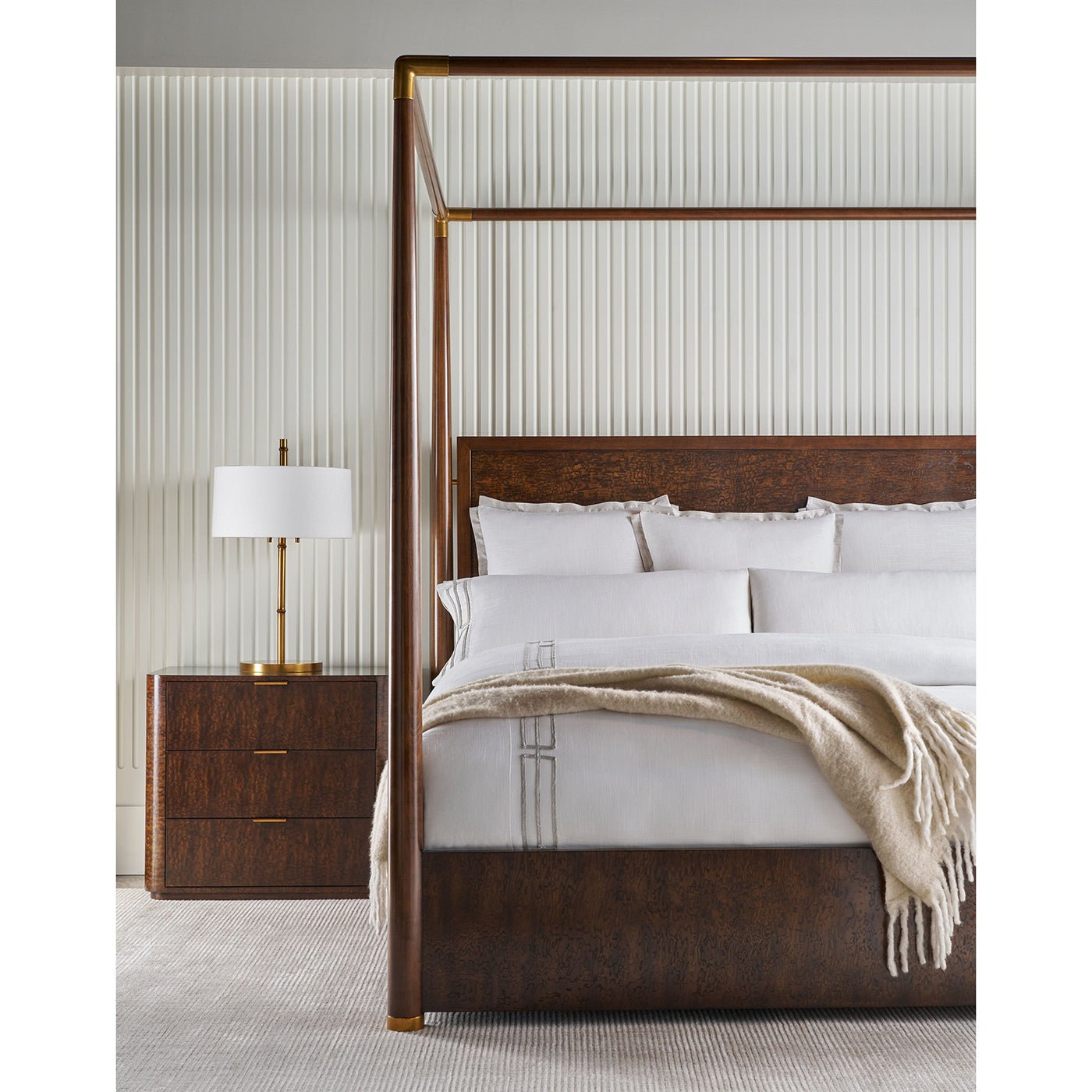 Mid century canopy bed in styled bedroom setting.