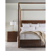 Mid century canopy bed in styled bedroom setting.