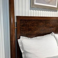 Mid century canopy bed headboard and linens detail.