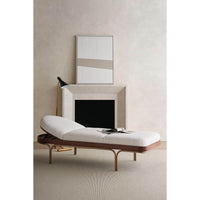 Mid-century chaise lounge, partially raised backrest in room.