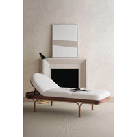 Modern chaise lounge, fully upright cushion in minimal space.