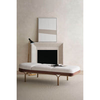 Room view, chaise lounge with neutral decor.