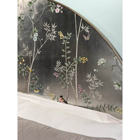 Detailed floral design on king bed headboard.
