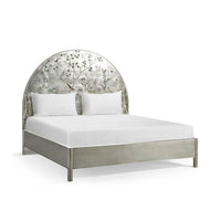 King bed with floral Chinoiserie headboard, side view.