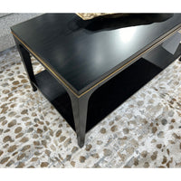 Corner view of mid-century coffee table on patterned rug.