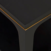 Detailed edge of black mid-century coffee table design.
