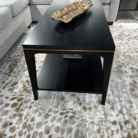 Mid-century coffee table centerpiece on modern carpet.