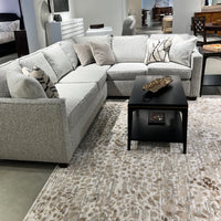 Mid-century coffee table placed in stylish living room setup.