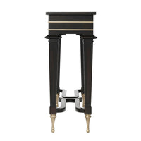 Side view of black mid century console table.