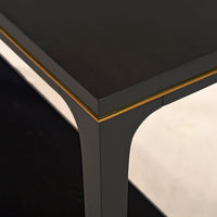 Close-up of tabletop and corner detailing on console table.