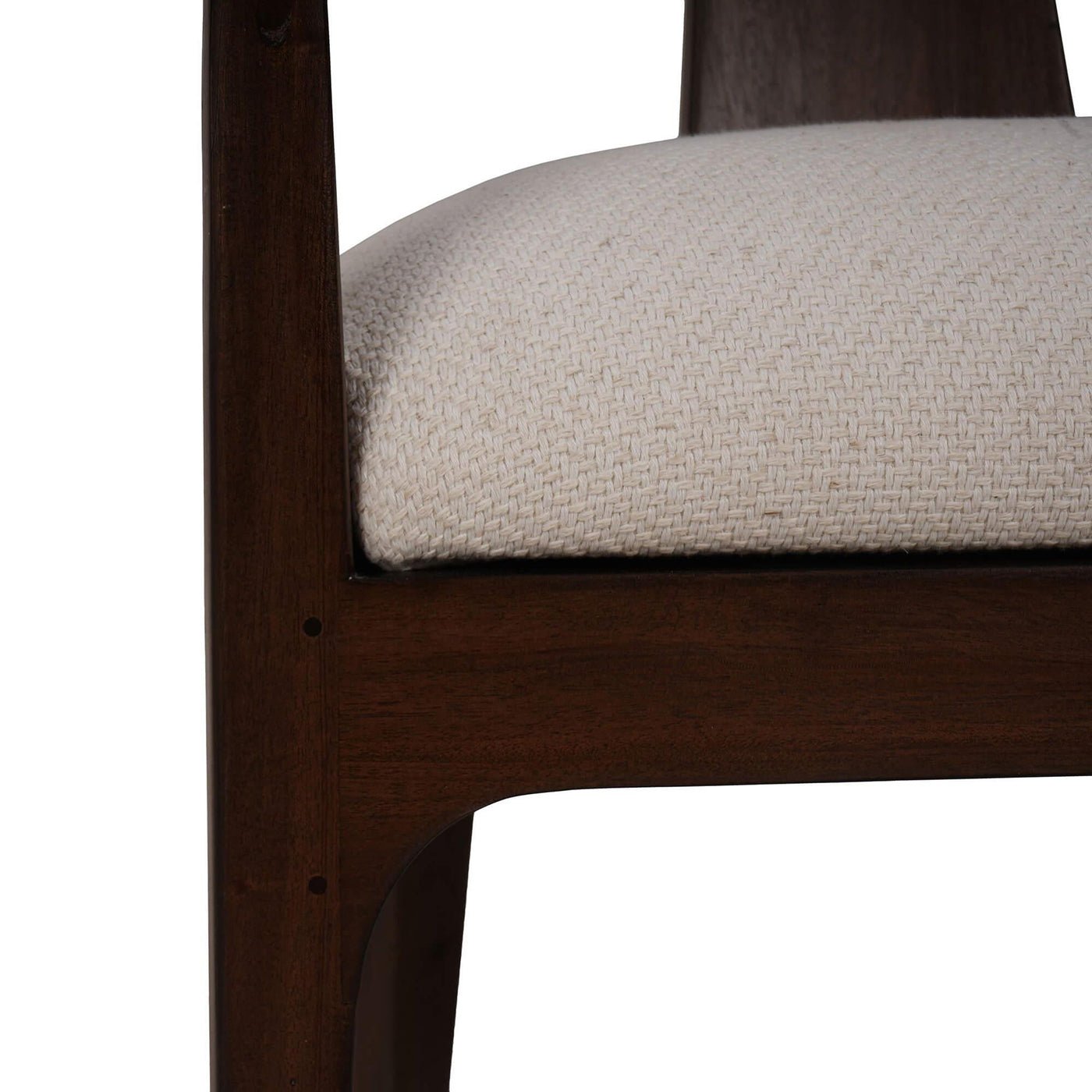Close-up of cream seat on dining armchair.