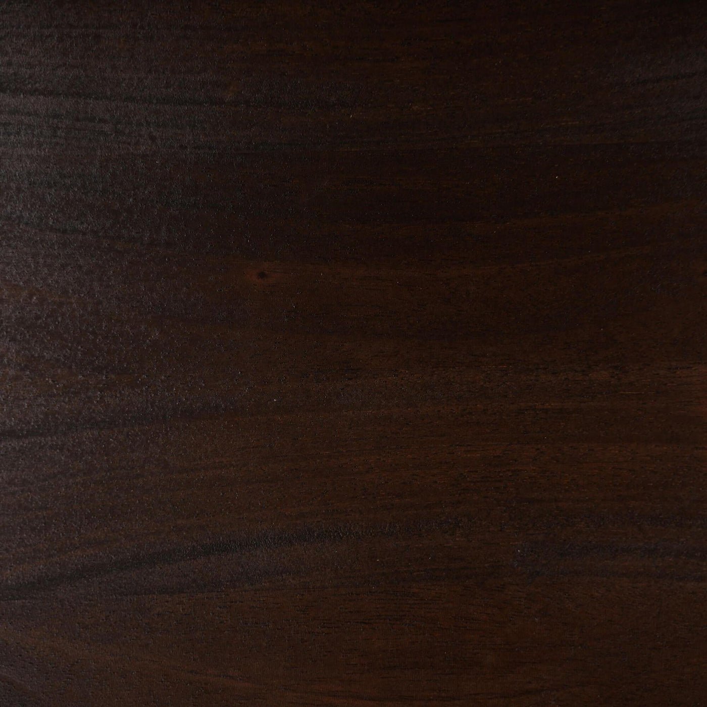 Detail of walnut wood texture on armchair.