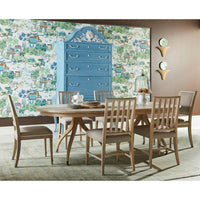 Dining table set with chairs and blue cabinet.