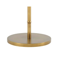 Lamp base detail showing round gold foundation.