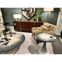 Stylish room setting with gold floor lamp and furniture.