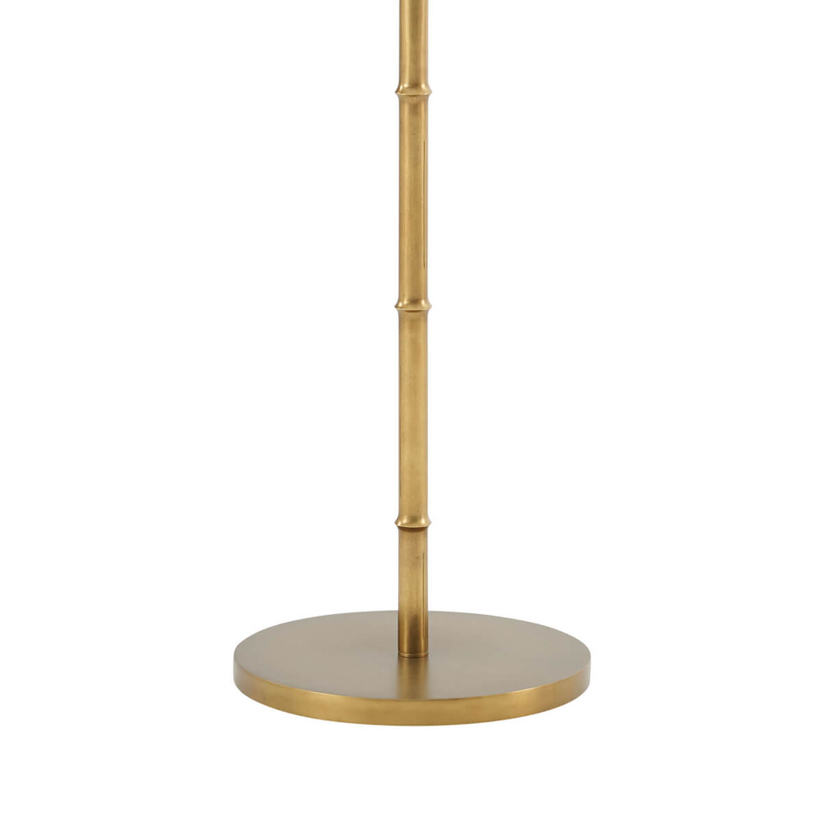 Gold floor lamp base with textured finish, overhead view.