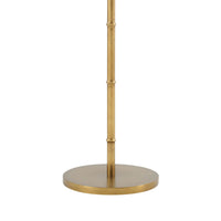 Gold floor lamp base with textured finish, overhead view.