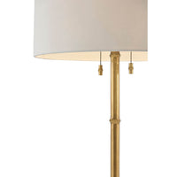 Close-up of gold lamp post with dual pull chains.