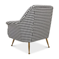 Rear angled view of houndstooth mid-century armchair.
