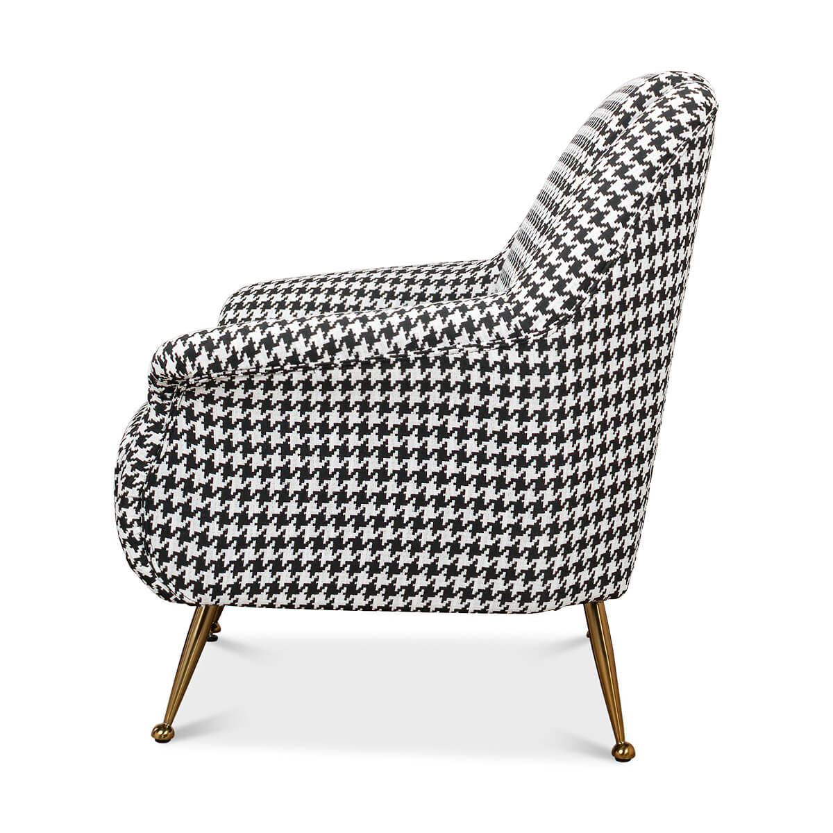 Side profile of a houndstooth mid-century armchair.