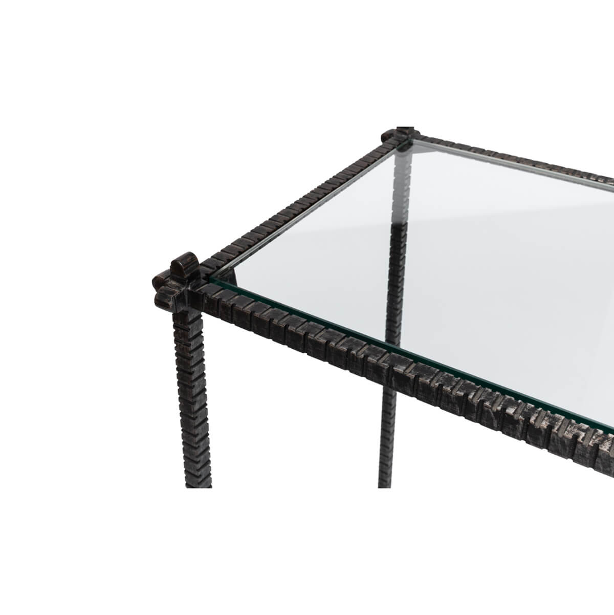Close-up of table corner, iron and glass detail.