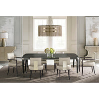 Elegant dining setup with mid-century chairs and table.