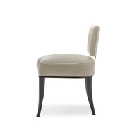 Beige mid-century dining chair, side profile view.