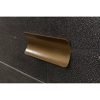 Brass handle close-up on gray leather side table