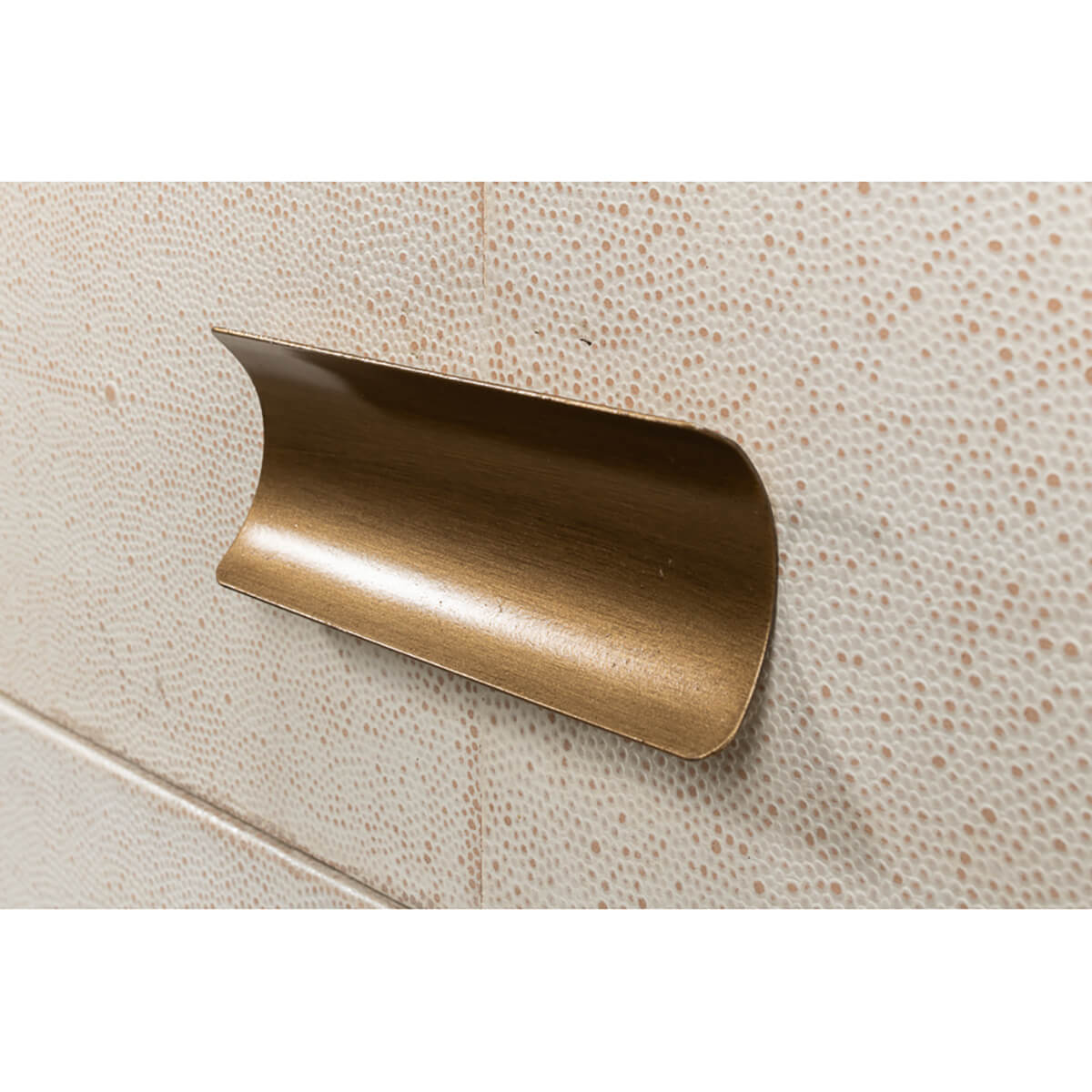 Brass handle detail on leather side table drawer.
