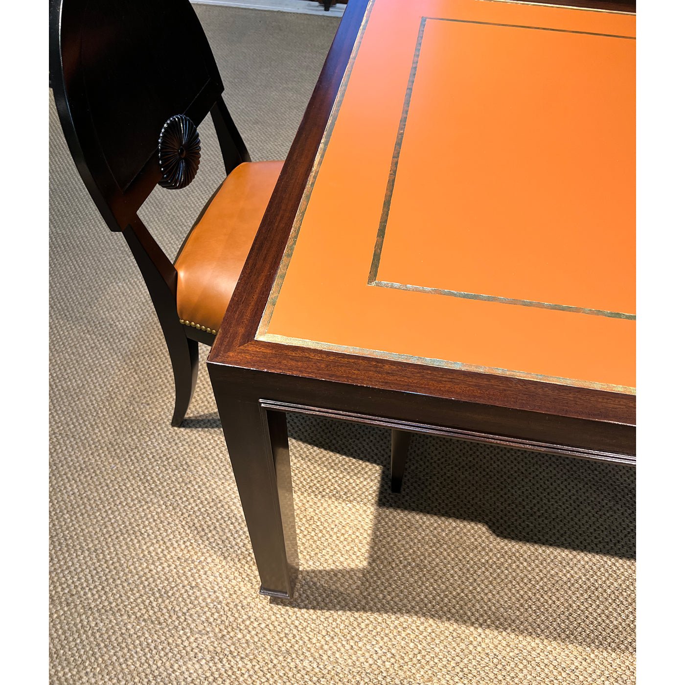 Close-up game table corner with chair in room setting.
