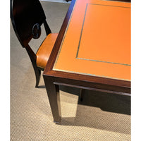 Close-up game table corner with chair in room setting.