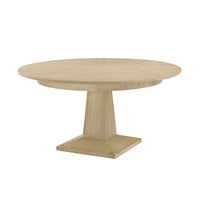 Round oak dining table, angled side view.