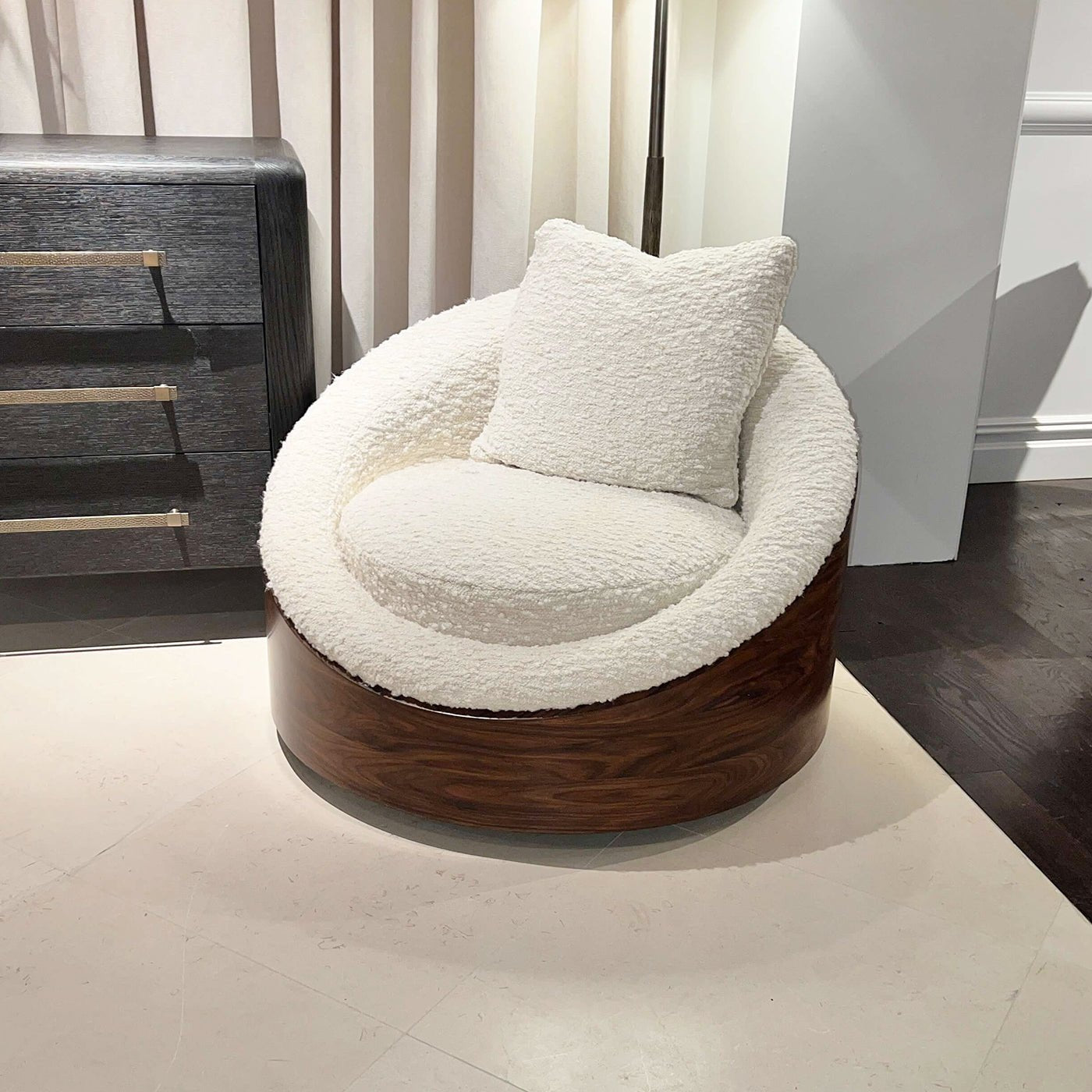Lounge chair in elegant room, white cushion, pillow.