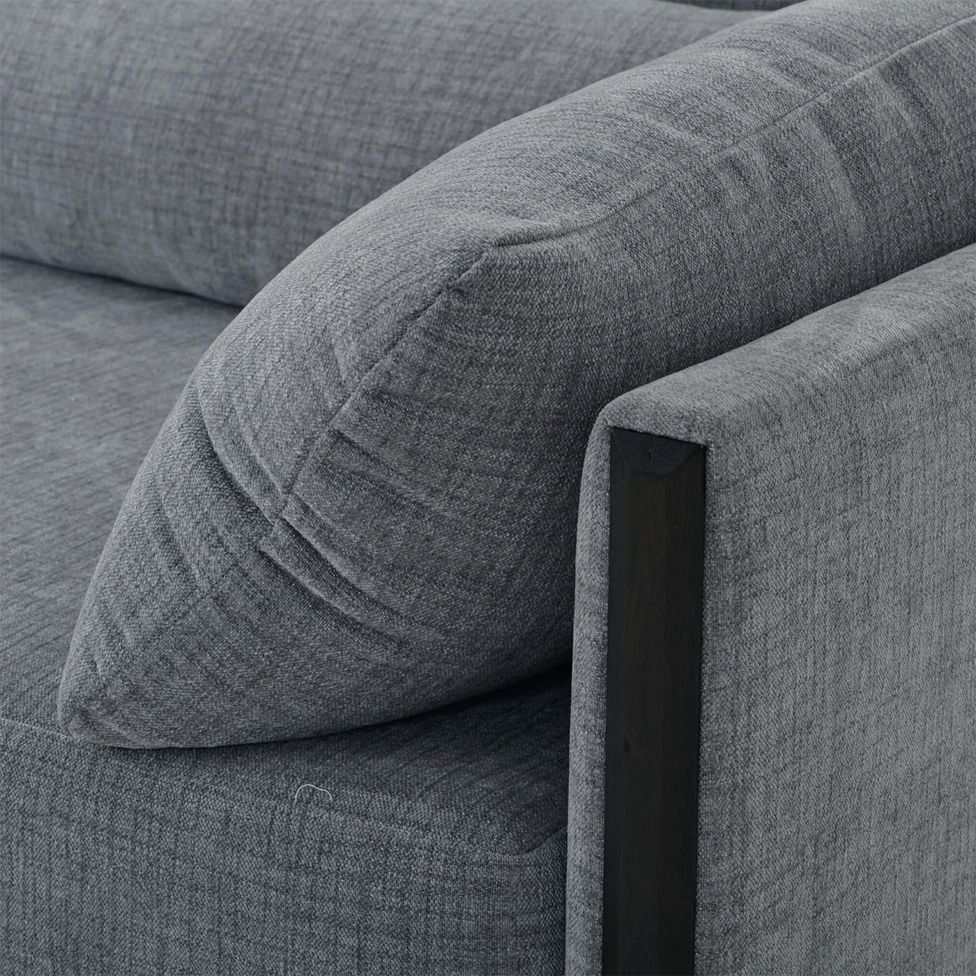 Close-up of mid-century sofa armrest detail.