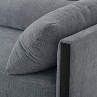 Close-up of mid-century sofa armrest detail.