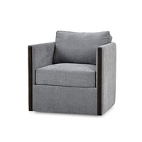 Gray swivel chair with cushions, side angle view.