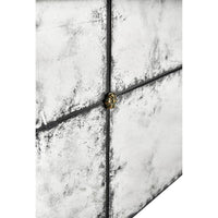 Close-up, metallic accent on mirrored cocktail table tile.