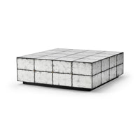 Square mirrored cocktail table, angled top view.