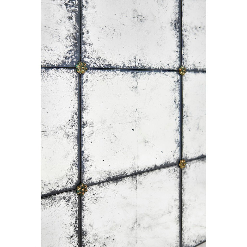 Close-up of corner detail on mirrored end table.