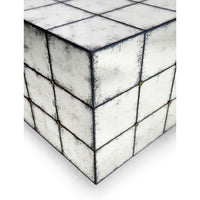 Bottom corner of mirrored end table detail.