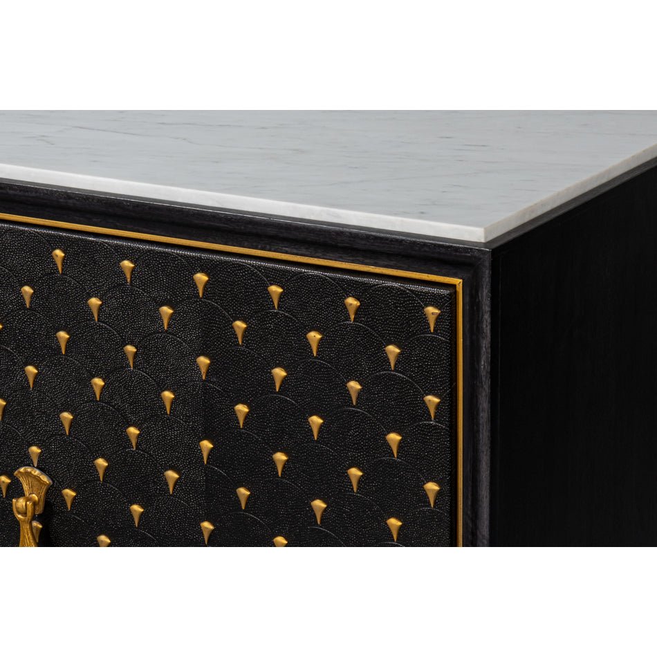 Corner detail of black and gold sideboard.